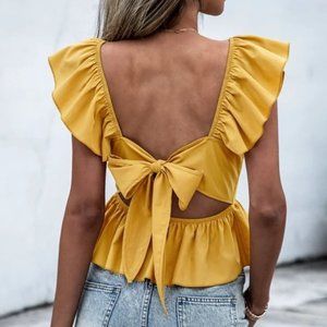 Contemporary minimalist Ruffle Sleeve Peplum Tie Back Blouse